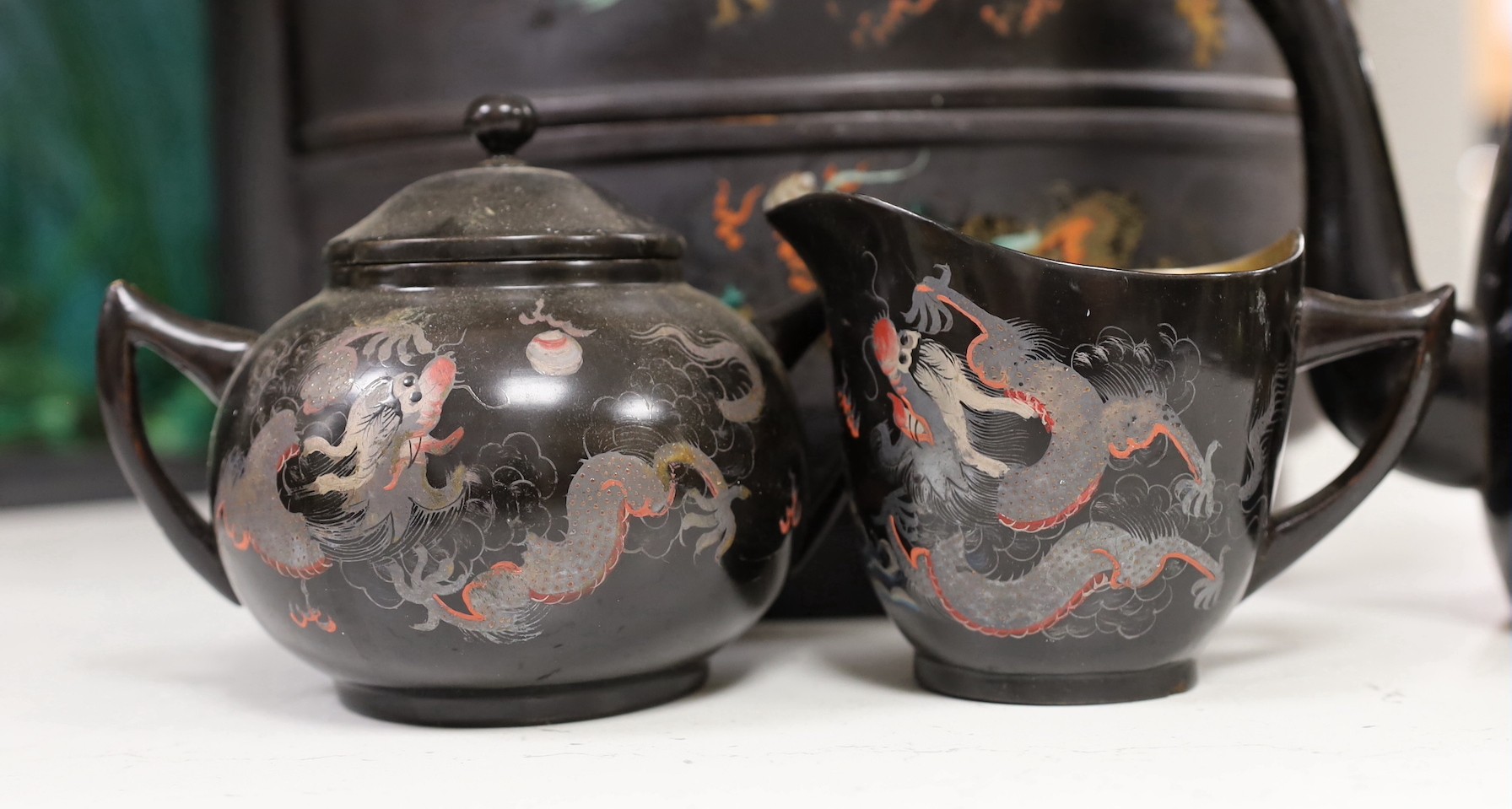 A Chinese Fuzhou lacquer ‘dragon’ wedding basket, 31cm high together with a similar teaset